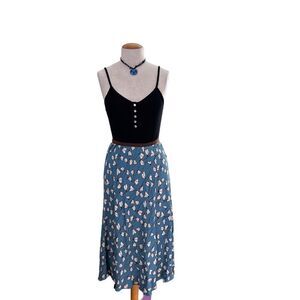 Skirt  ||  Light teal, back ground with a cream print throughout. Large
